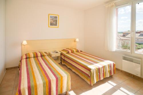 Кровать или кровати в номере Vacancéole - Port Minervois, Les Hauts du Lac