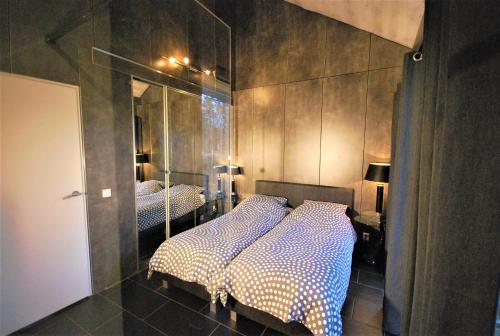 Comfortabele Vrijstaande Bungalow 3にあるベッド