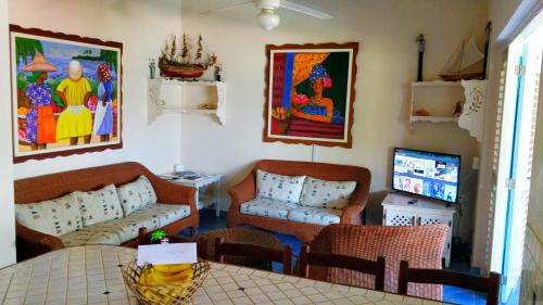 a living room with a couch and a table at A La Dolce Vita Beachfront Hotels, Las Terrenas, Samana in Las Terrenas