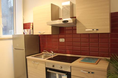 Η κουζίνα ή μικρή κουζίνα στο Santa Maria Suites