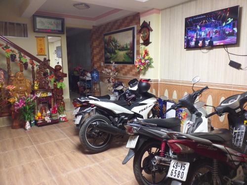 a group of motorcycles parked in a room at Nón Lá Guest House in Da Lat