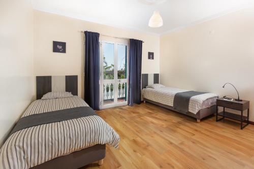 מיטה או מיטות בחדר ב-Cumbres Villa
