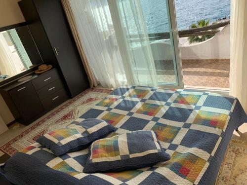 Postel nebo postele na pokoji v ubytování Bougainville Bay Resort - Villa 11