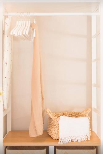 a shelf with a pillow and a towel at Locanda Angelica in Giarratana