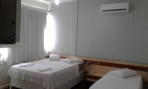 Postel nebo postele na pokoji v ubytování Hotel Premier