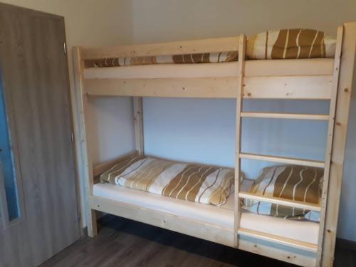 Postel nebo postele na pokoji v ubytování Apartman Dominik