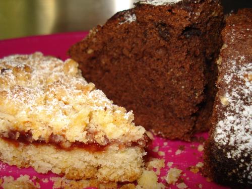two pieces of cake sitting on a pink plate at Breezes B&B in Conca Specchiulla