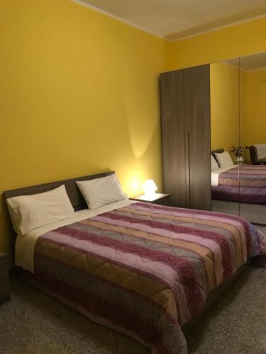 Posteľ alebo postele v izbe v ubytovaní B&B da nonna Vincenza
