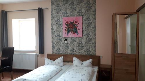 Postel nebo postele na pokoji v ubytování Hotel Wittenberg-Hotel Garni