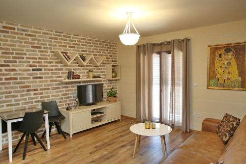 a living room with a brick wall at Anja in Kotor