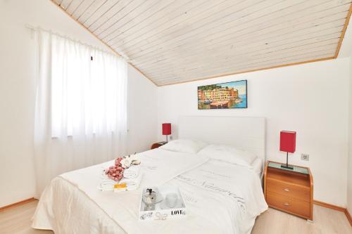 Posteľ alebo postele v izbe v ubytovaní Apartments Gvarda