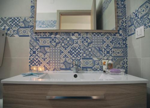a bathroom with a sink and a mirror at Villalba in Balestrate