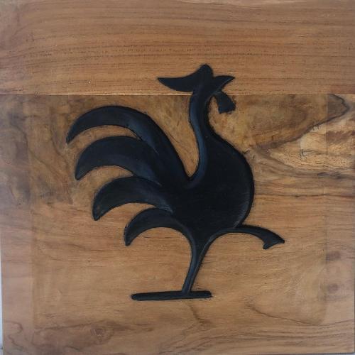a black silhouette of a bird on a wooden table at Les Cabanes Perchées in Bouillante