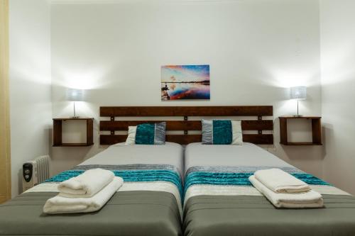 Postelja oz. postelje v sobi nastanitve Casa Piscinas Naturais
