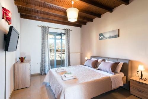Postel nebo postele na pokoji v ubytování Cozy Family Friendly Apartment with large garden close to beaches - Dirella
