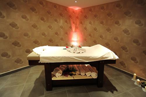 a room with a bed with a light on it at Askoc Hotel & SPA in Istanbul
