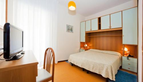 Postel nebo postele na pokoji v ubytování Hotel Universal