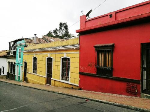 a row of colorful buildings on a street at Casa artistica CANDELARIA in Bogotá