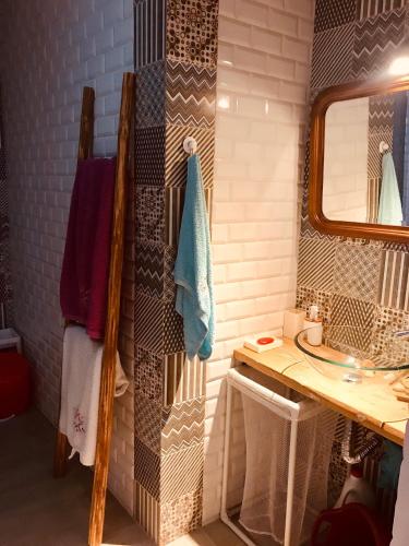 a bathroom with a sink and a mirror at CASA BIKAS in Barão de São Miguel