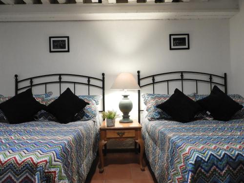 Ein Bett oder Betten in einem Zimmer der Unterkunft El Rincón de Cervantes Secret House by Lunian