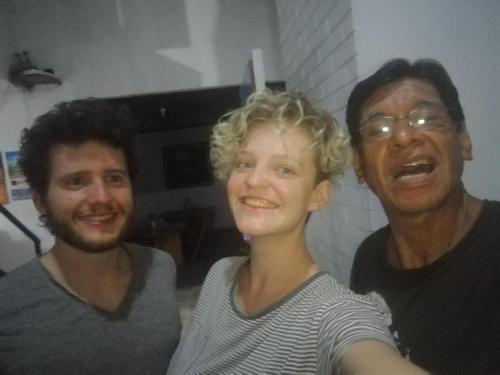 two men and a woman posing for a picture at Poseidon Guest House in Iquitos