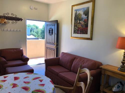 a living room with a couch and a table at Casa Del Sol in Carpinteria