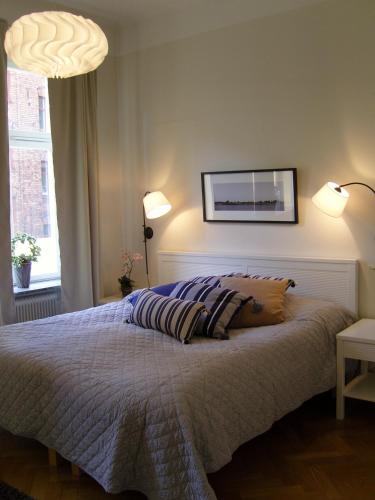 Кровать или кровати в номере Executive Living Södermalm Chic