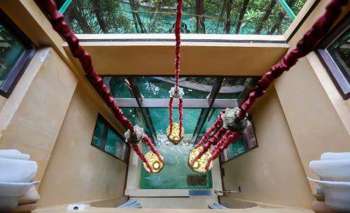 a chandelier hanging from the ceiling of a building at Sawasdee Village in Kata Beach