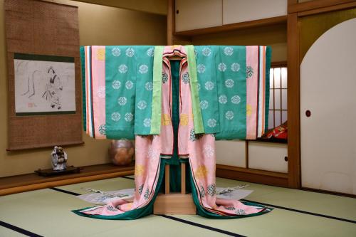 a room with a table with curtains on it at Seikoro Ryokan - Established in 1831 in Kyoto