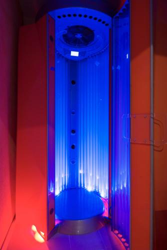 a room with a blue and red lighted room at ibis Styles Warszawa West in Mory