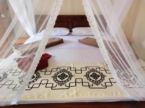 Postel nebo postele na pokoji v ubytování Jade Green Rest Inn