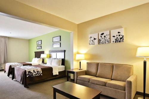 Кровать или кровати в номере Sleep Inn & Suites Abilene Near University