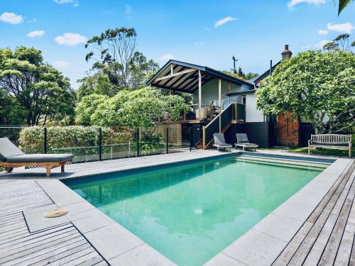 a swimming pool in the backyard of a house at Beluso in Byron Bay