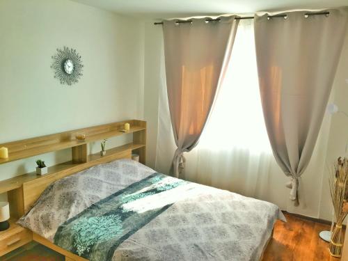 a bedroom with a bed and a window at Byala Apartments BSR 7 in Byala