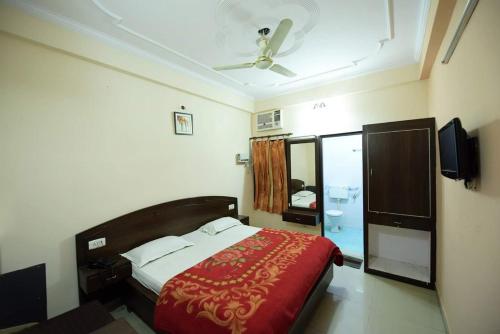 Voodi või voodid majutusasutuse Hotel Ganga Vilas toas