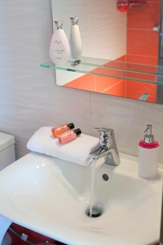 a bathroom sink with a towel and a faucet at Nema Villa in Meganisi