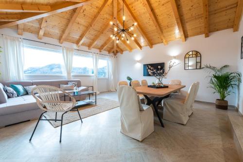 a living room with a table and chairs at Villa Paulina in Mlini