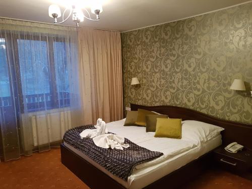 Un pat sau paturi într-o cameră la Hotel Esprit