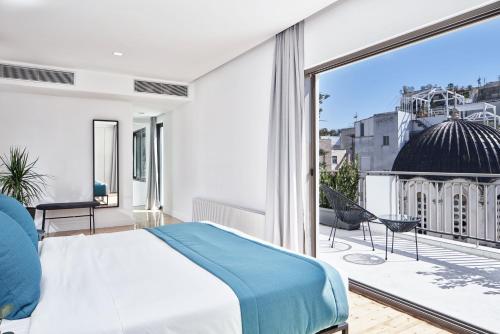 Posteľ alebo postele v izbe v ubytovaní MONO Lofts