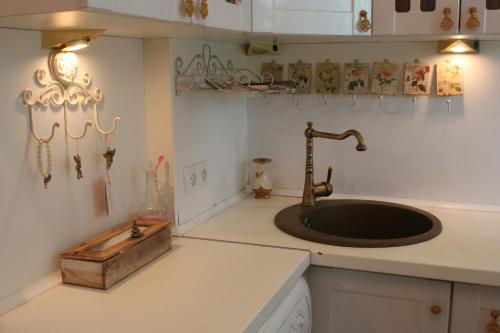 a kitchen with a sink and a counter top at Апартаменты возле Вокзала, Центр in Dnipro