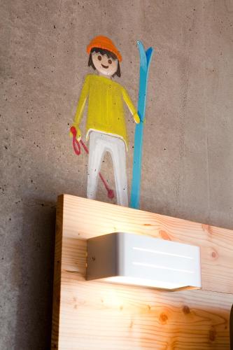a drawing of a person on the wall at Anova Hotel & Spa in Montgenèvre