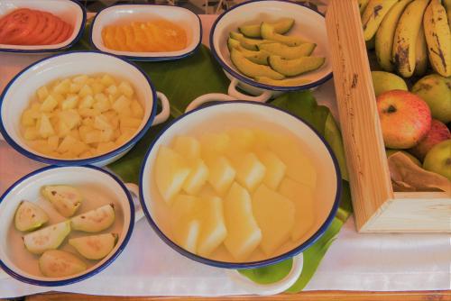 a bunch of bowls filled with different types of fruit at Herdade do Ananás in Ponta Delgada