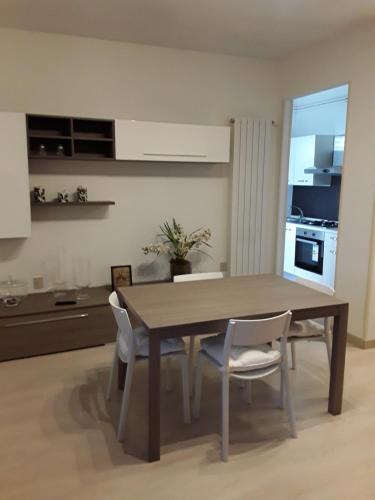 a dining room table and chairs in a kitchen at Ca' dei Mille in Iseo