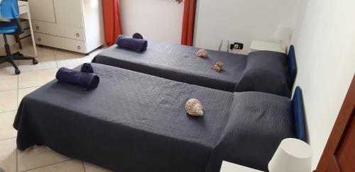 מיטה או מיטות בחדר ב-Residenza Il Castello