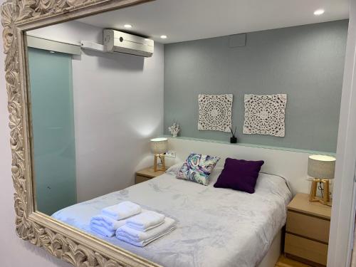 Кровать или кровати в номере Apartamento Rambla Catalunya