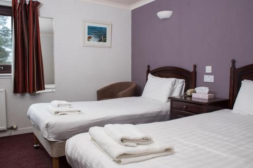 Cama o camas de una habitación en Kyle Hotel ‘A Bespoke Hotel’