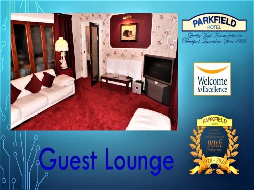 a guest lounge room with a couch and a television at Parkfield Hotel in Blackpool
