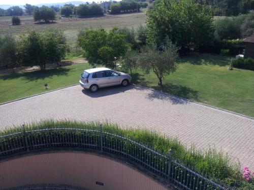 a car parked on a road with a bridge at Luconi Affittacamere in Iesi