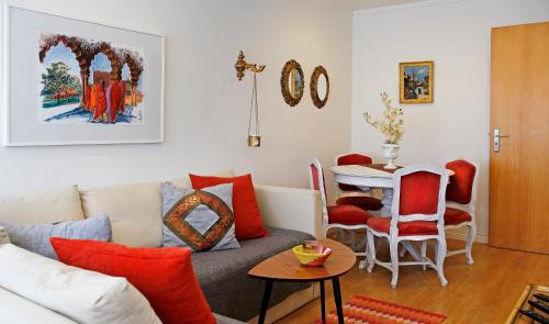 a living room with a couch and a table at Anjos 44 Lisbon Apartments in Lisbon
