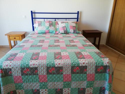 Un pat sau paturi într-o cameră la Rossio Sol Mar